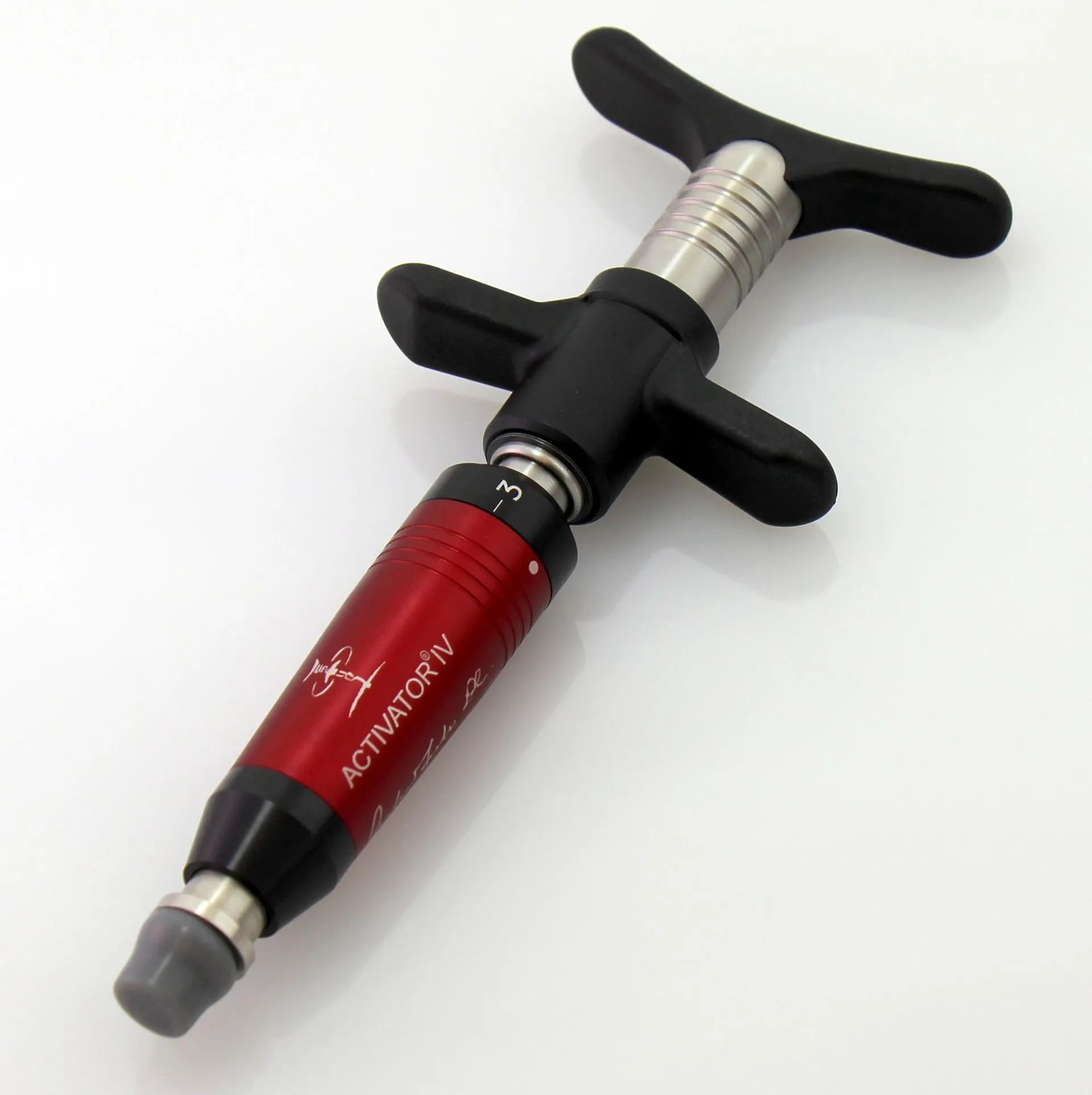 Activator instrument used in gentle, crack-free chiropractic adjustments