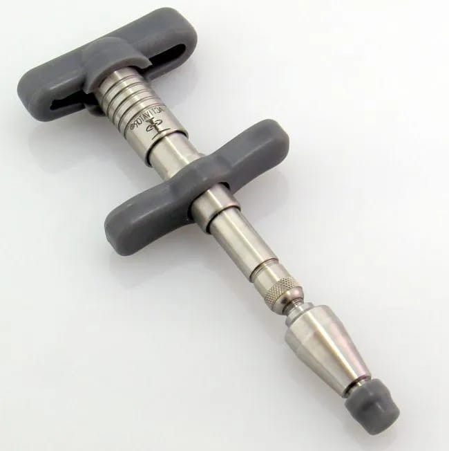 Activator instrument used in gentle non-cracking chiropractic adjustments