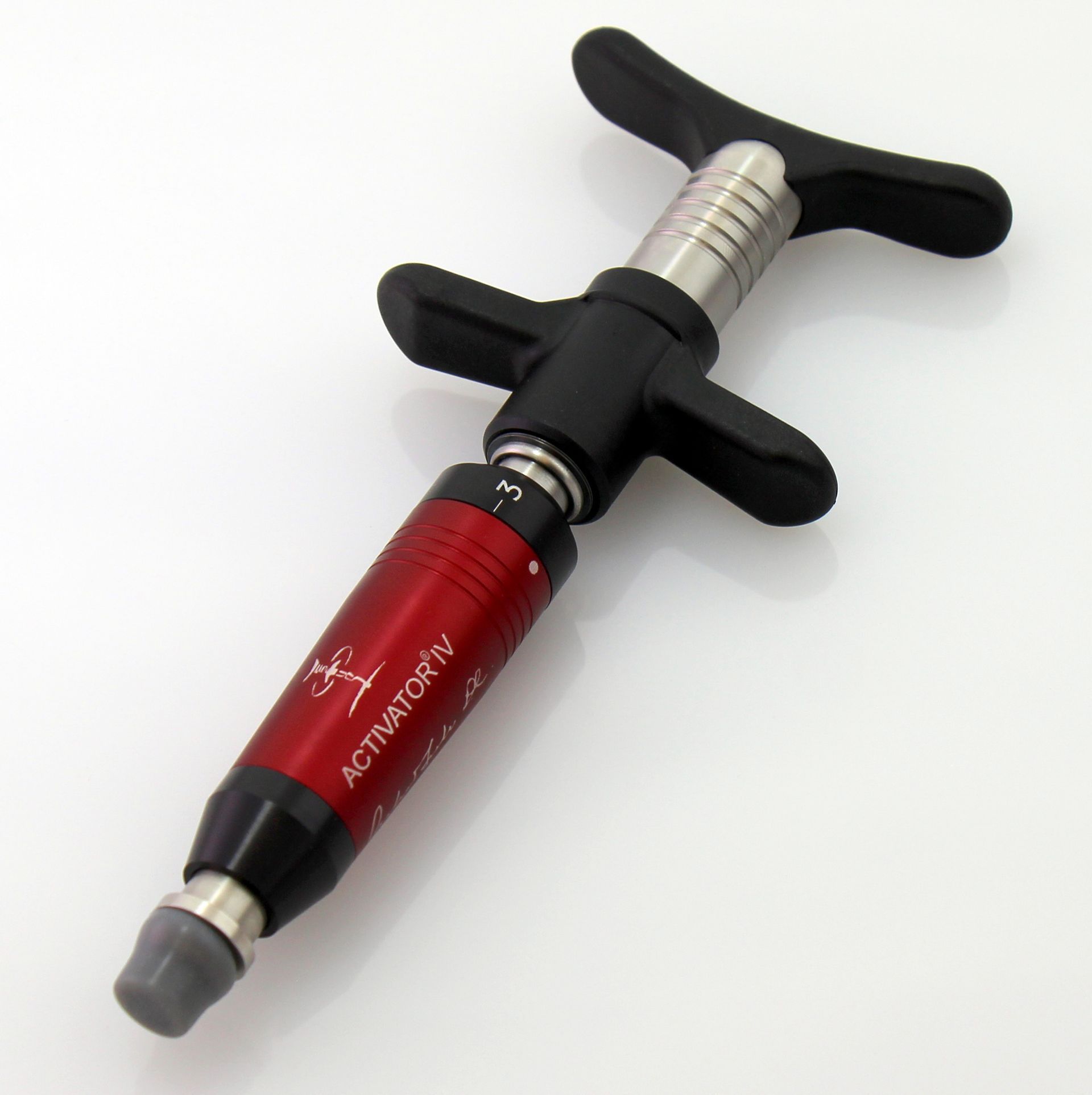 Activator IV instrument used in gentle, crack-free chiropractic adjustments