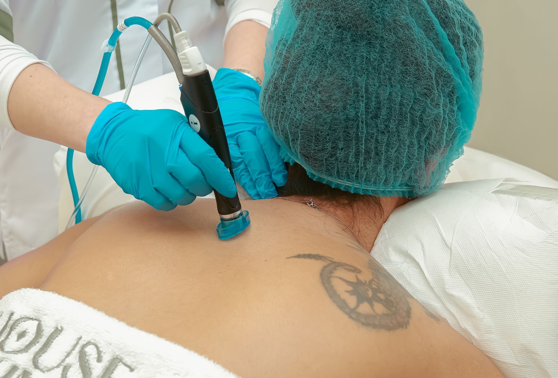 Medical laser treatment being applied to a patient's back