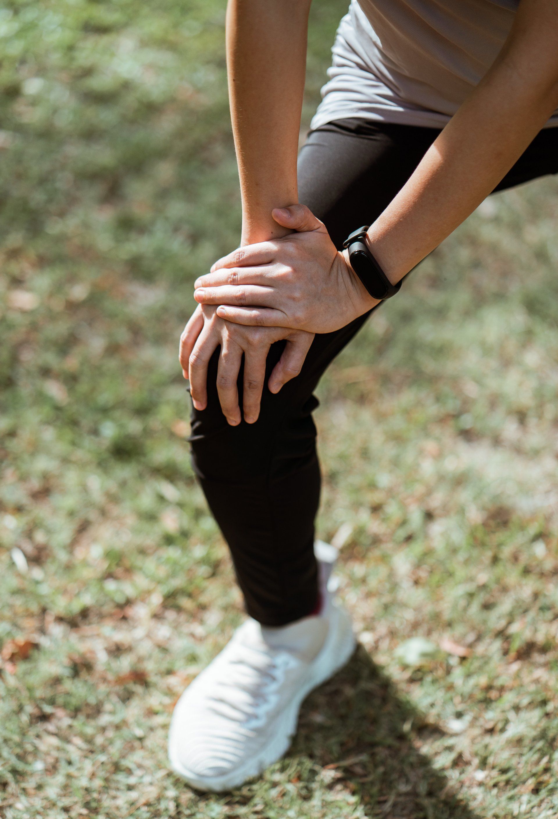 Person experiencing knee pain
