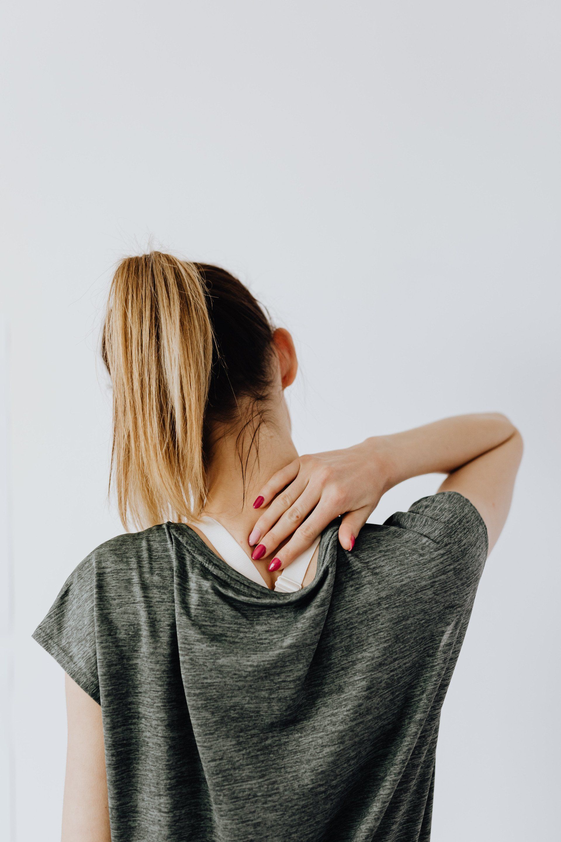 Person experiencing neck pain