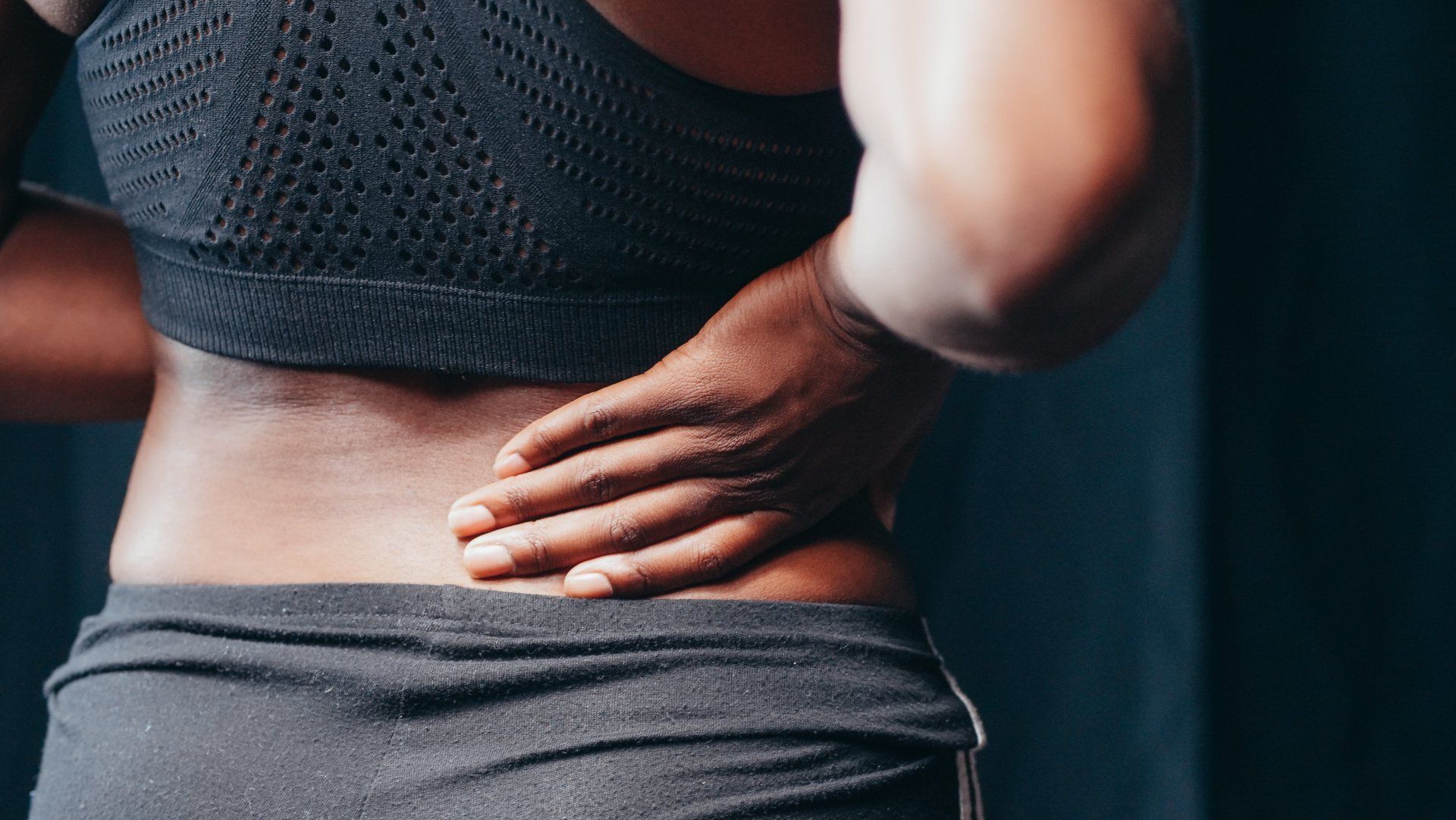 Person experiencing lower back pain